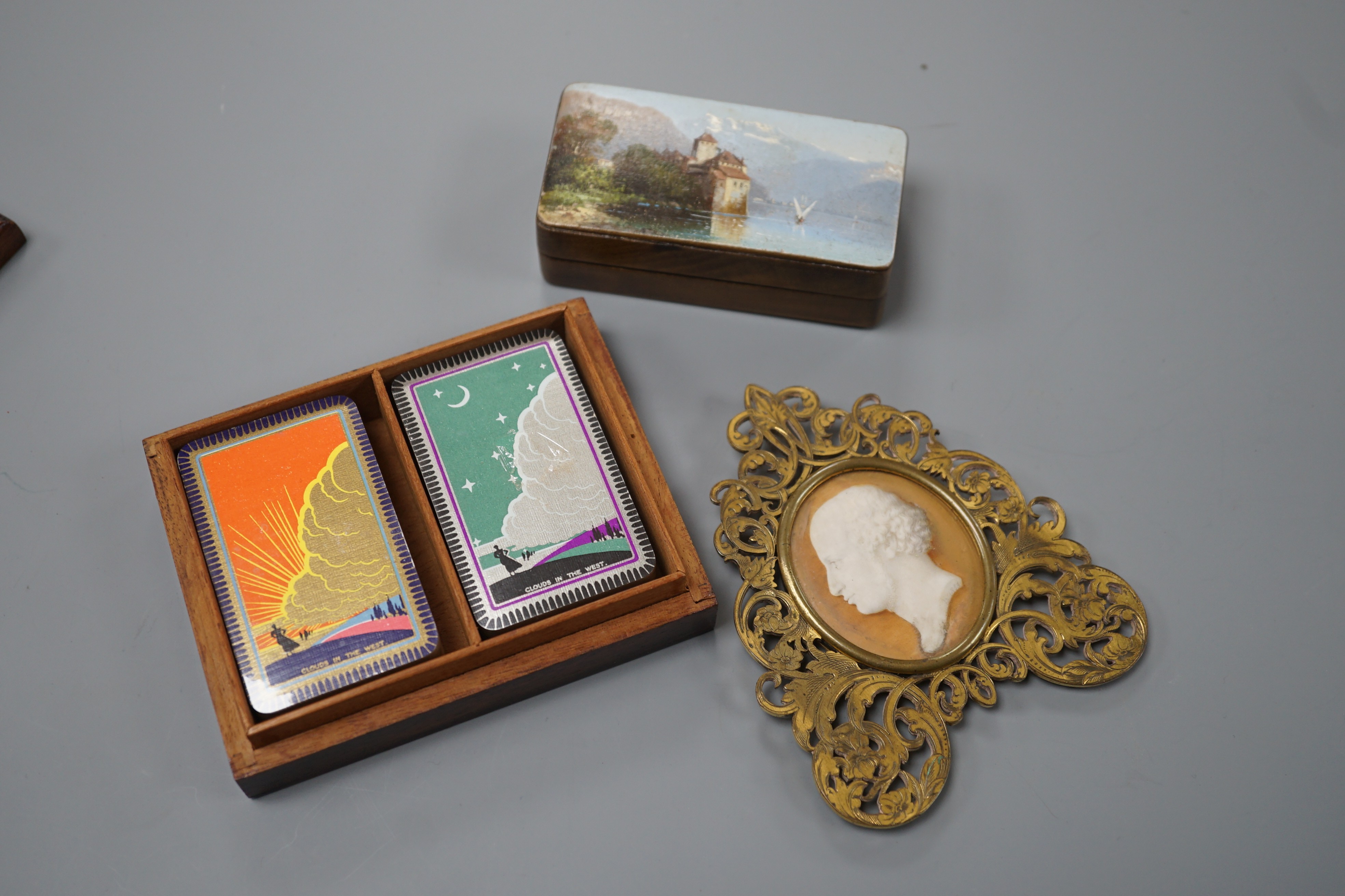 A mid 19th century portrait miniature on ivory in a gilt brass frame, a Tunbridge ware playing card box, 10.7cm and a Swiss painted wood stamp box (3)